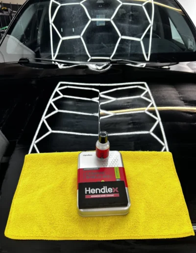 HENDLEX ceramic coating kit on a freshly coated car under hex lighting