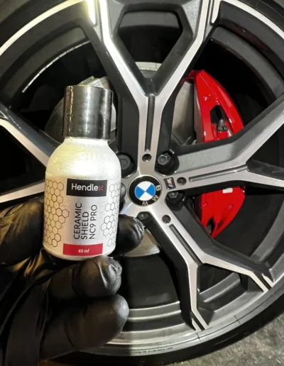 HENDLEX ceramic wheel coating on a BMW wheel with red calipers